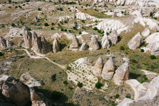Stunning aerial view of Cappadocia's iconic rock formations and sweeping landscape.