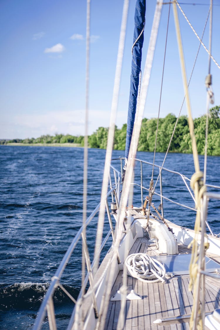 Recreational Boat With Masts On A Blue Lake