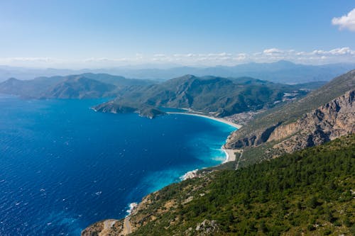 Aerial Photo of an Ocean and Mountains