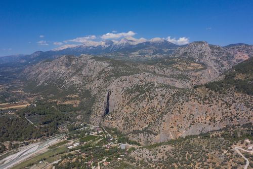 Free Stunning aerial view of rugged mountains under a clear blue sky. Stock Photo