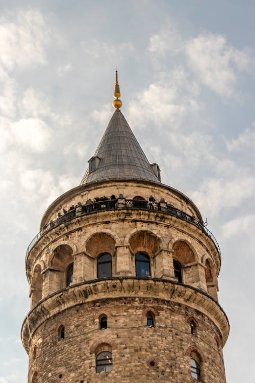 Free A Low Angle Shot of Galata Tower Under the Cloudy Sky Stock Photo