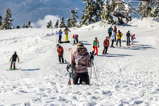 Group of skiers enjoying a sunny winter day on the snowy slopes of Bursa, Turkey.