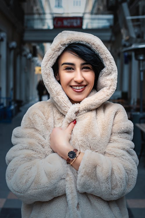 A Woman Fur Hoodie Jacket Smiling