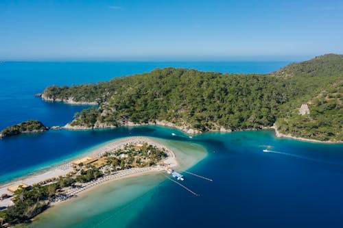 Aerial View of Green Trees on Mountain and Island on Blue Sea