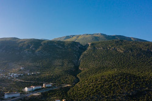 Aerial View of Green Mountains under Blue Sky 