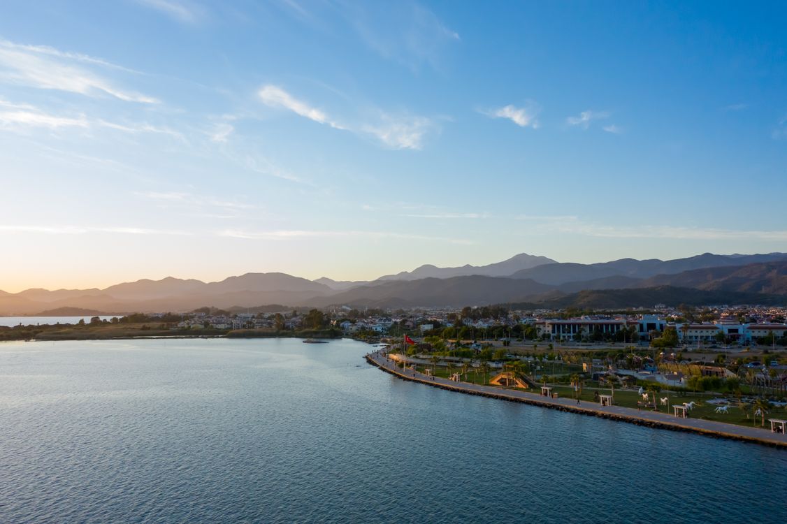 Aerial View of Coastline of a Coastal City and Mountains in the ...