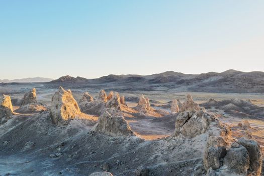 Captivating view of the Trona Pinnacles under clear blue skies in California's arid desert region.