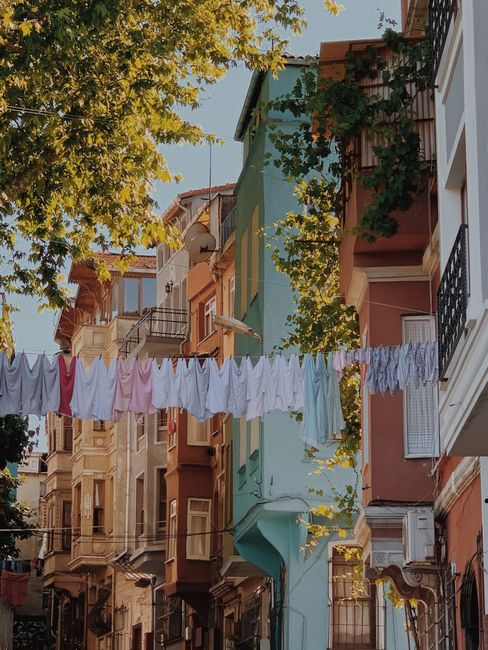 Charming Istanbul street with colorful facades and laundry hanging between buildings.