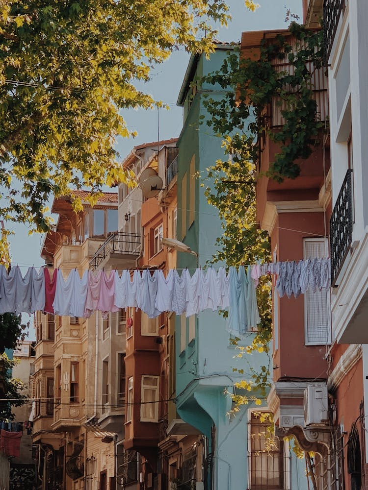 String Of Laundry Hanging Over A City Street