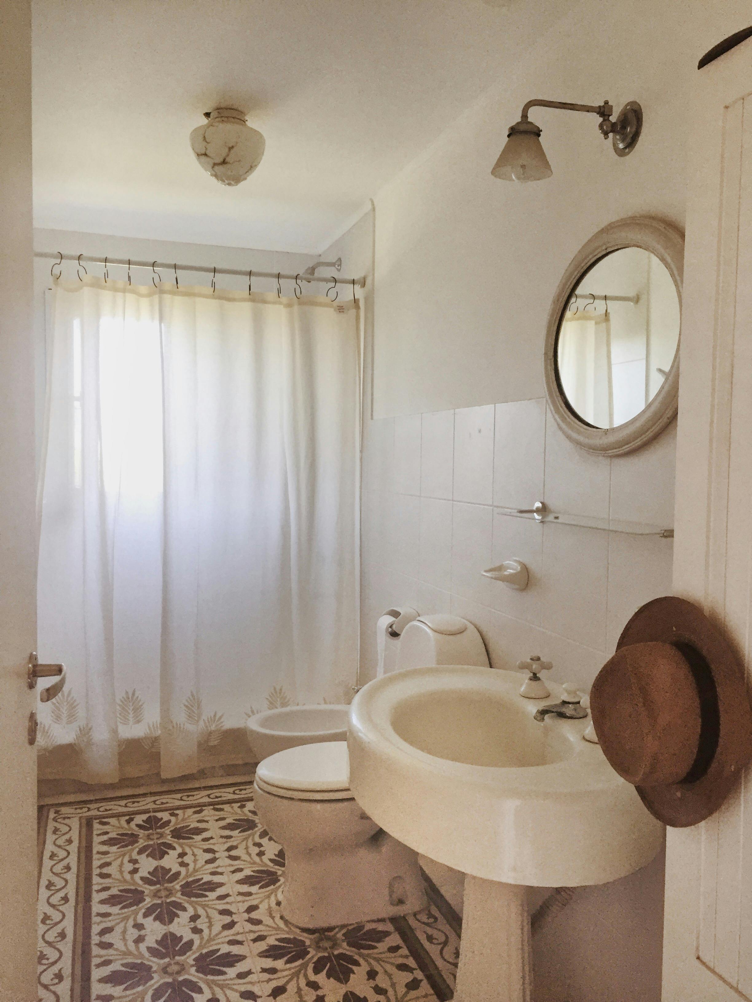 Neutral bathroom with patterned tile accents for subtle character