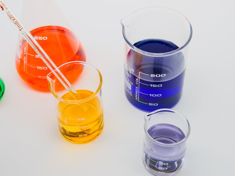 Close-Up View Of Colorful Liquids In Laboratory Glasswares