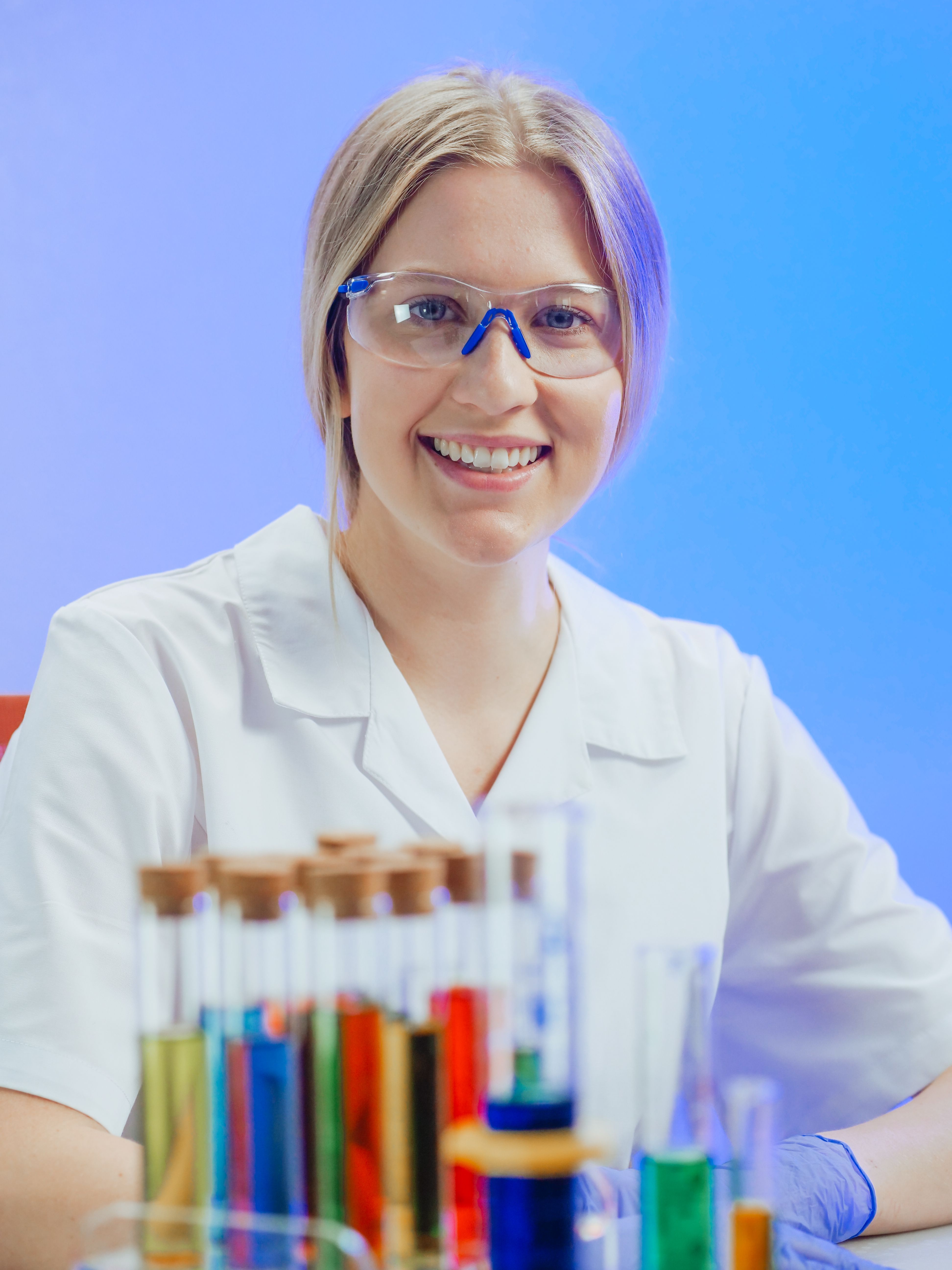 Woman in White Coat Smiling · Free Stock Photo