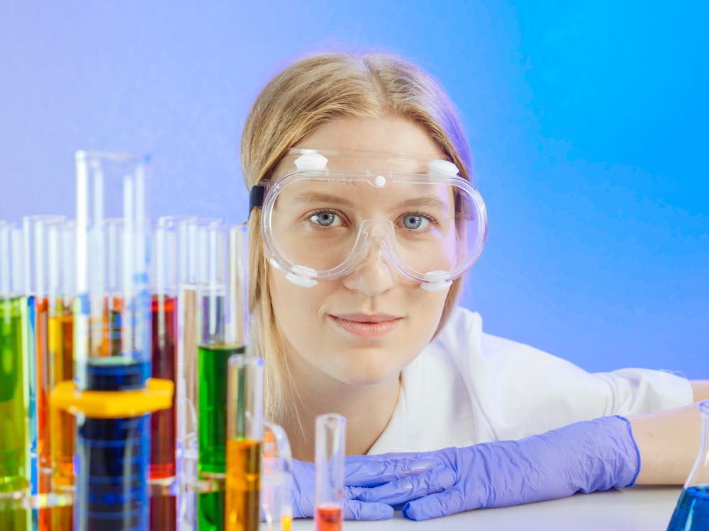 A Woman Wearing Safety Glasses while Smiling