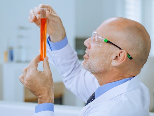 Close-Up Photo of a Man Doing an Experiment