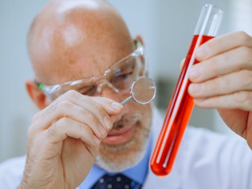 Free Close-Up Photo of a Man Doing an Experiment Stock Photo