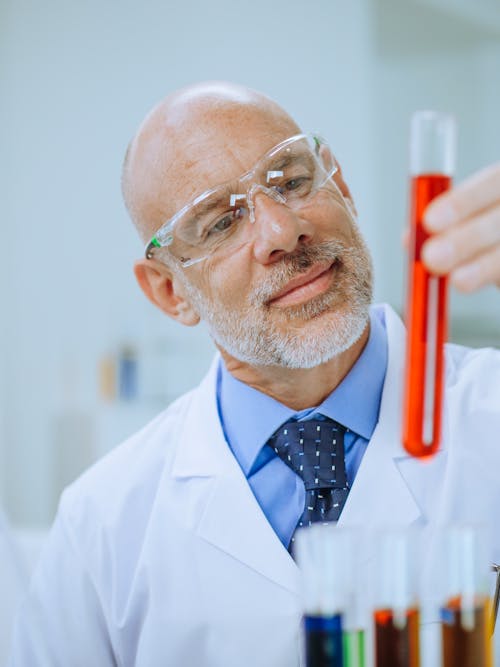 Close-Up Photo of a Man Doing an Experiment