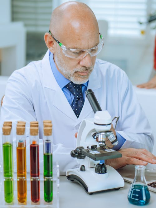 Man in White Coat Doing an Experiment