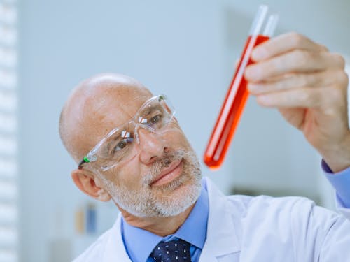 Close-Up Photo of a Man Doing an Experiment