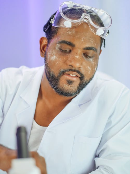 Man in White Coat Doing an Experiment