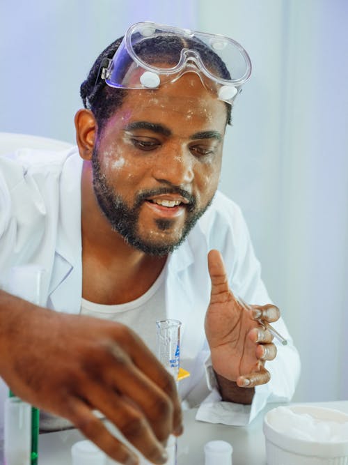 Man in White Coat Doing an Experiment