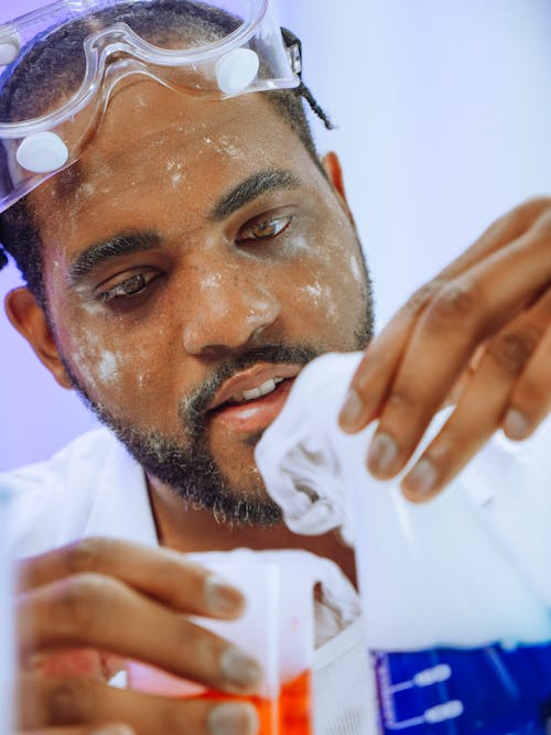 Close-Up View of a Man Doing an Experiment