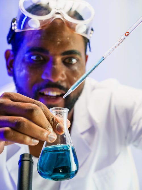 Close-Up View of a Man Doing an Experiment