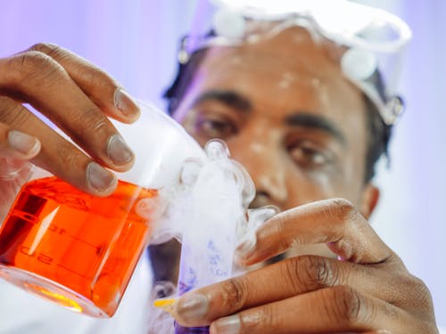 Close-Up View of a Man Doing an Experiment