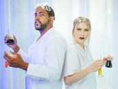 Man and Woman in White Coat Doing an Experiment