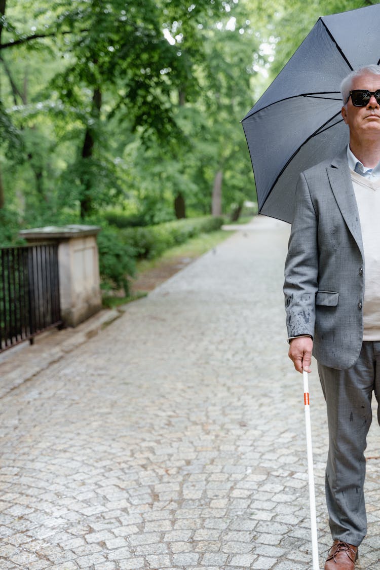 A Blind Man In Gray Suit