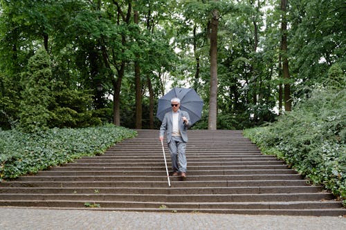 Photo of a Person Going Down the Steps