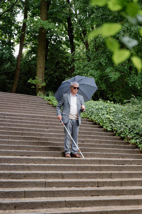 Blind man walking Stock Photo