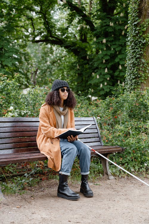 A Blind Woman Sitting on the Bench