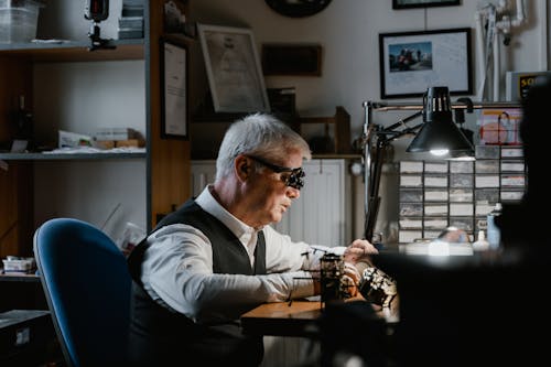 Elderly Man Repairing a Watch 