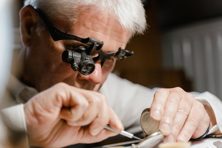 Man Repairing The Clock