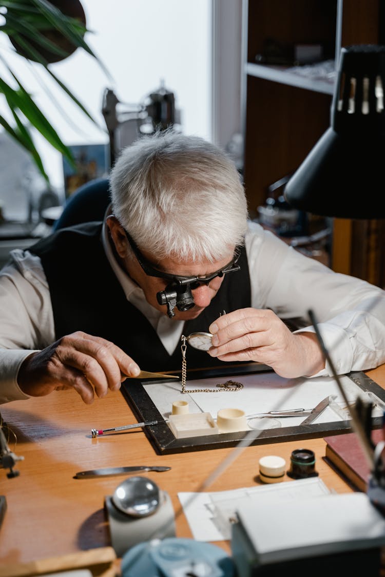 Man Repairing The Pocket Watch