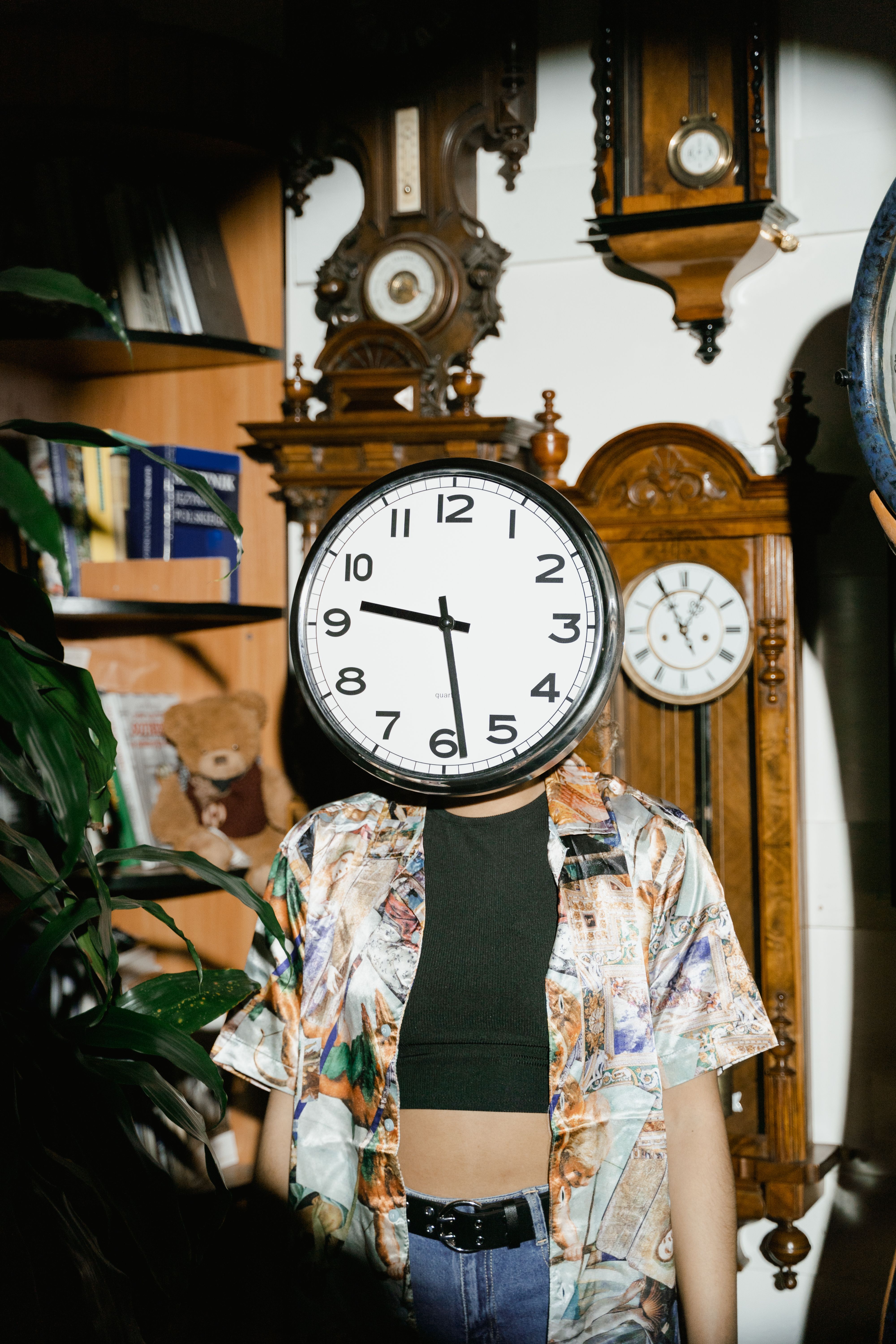 A Wall Clock Covering Person's Head · Free Stock Photo