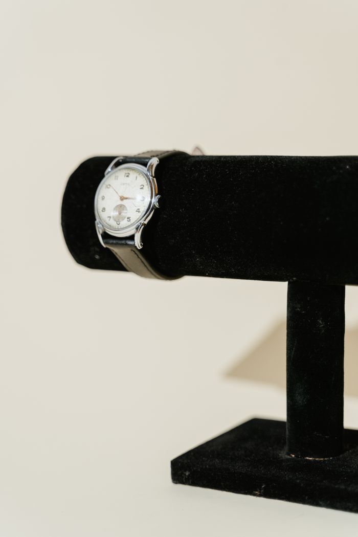 Vintage wristwatch on a velvet display stand — Tima Miroshnichenko on Pexels