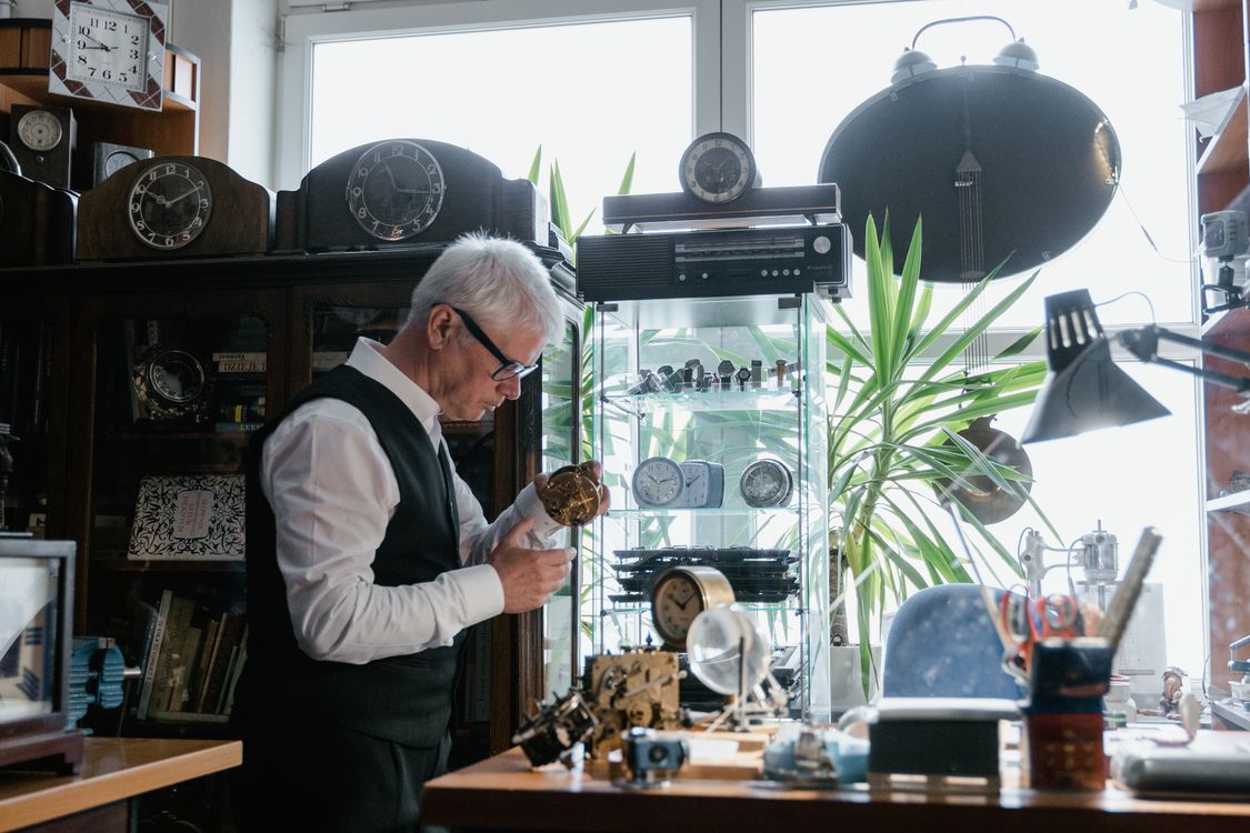 Man Fixing Clock An Elderly Man Fixing a Clock · Free Stock Photo