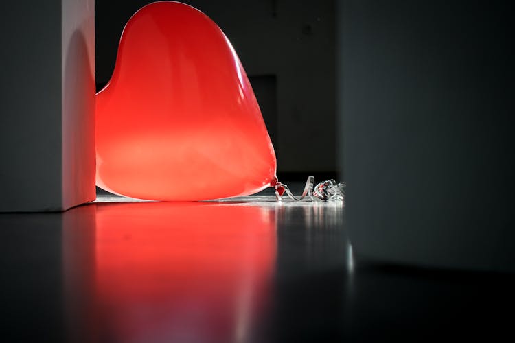 Red Heart Balloon On Top Of Floor