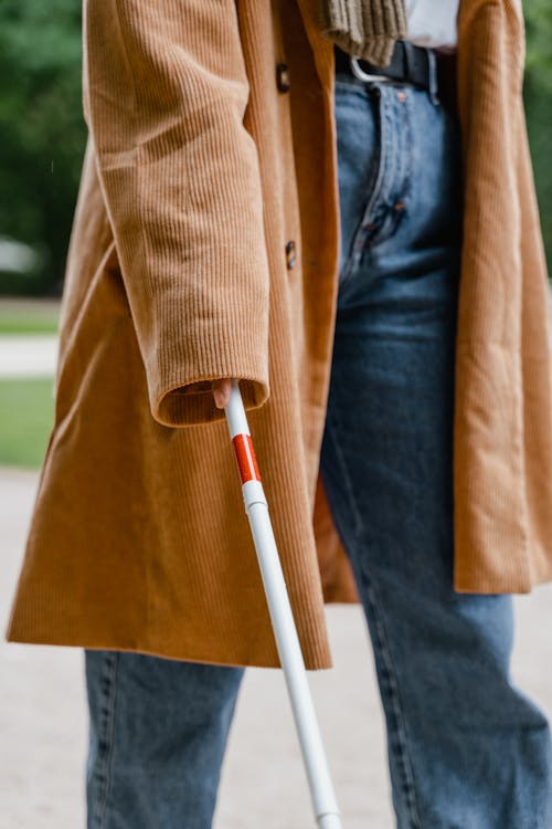 Free Person Holding a White Cane Stock Photo