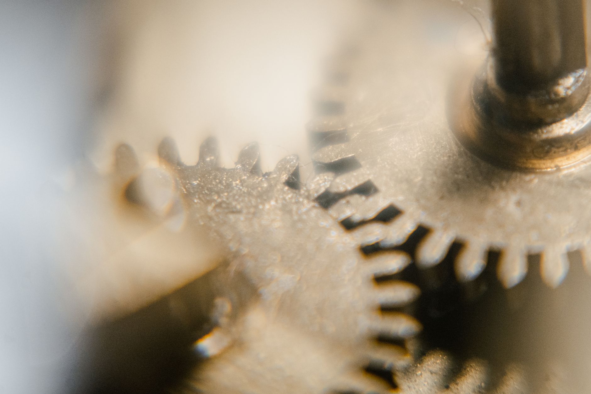 Detailed view of clock gears and cogs in a vintage mechanism showcasing precision engineering.