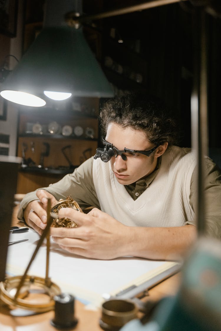 A Person Repairing A Watch