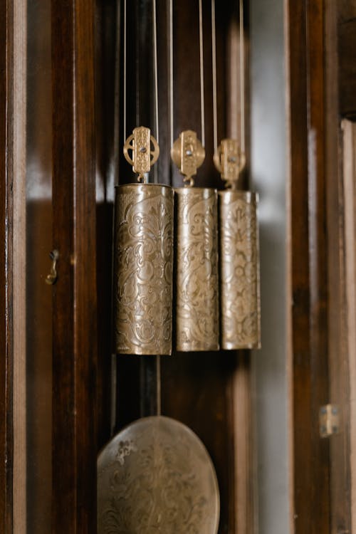 Close-up of Weights in an Antique Wall Clock 