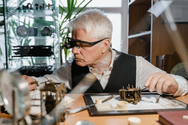 A Man Repairing A Watch