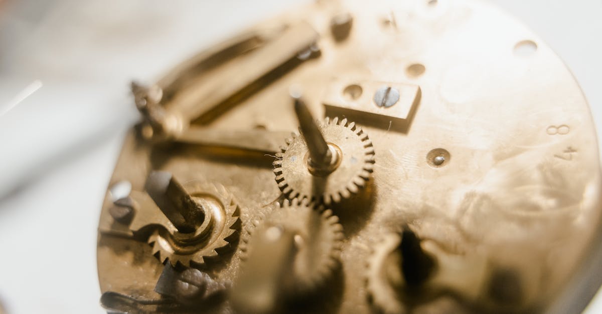Detailed view of a vintage clockwork mechanism showcasing intricate gears and metallic components.