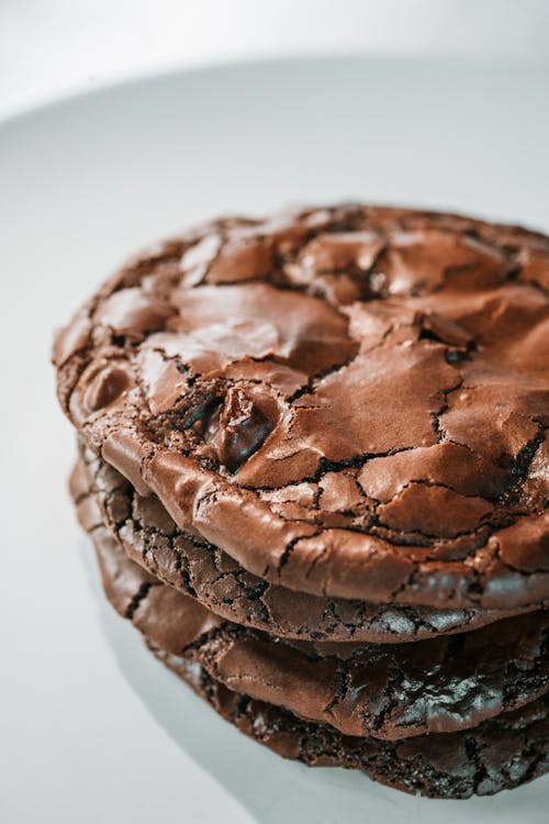 Close Up Photo of Chocolate Cookies on Ceramic Plate