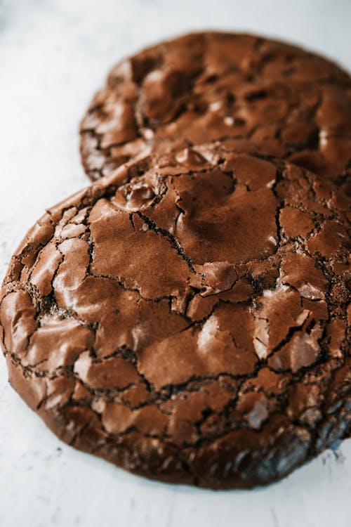 Close Up Photo of Chocolate Cookies on Ceramic Plate