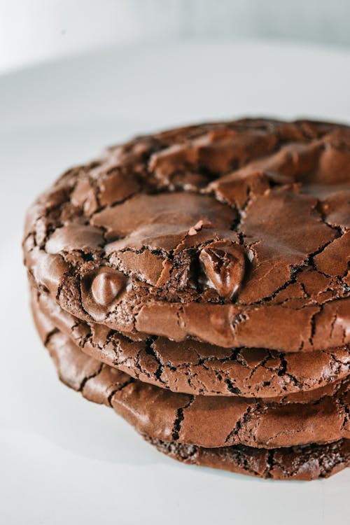 Close Up Photo of Chocolate Cookies on Ceramic Plate