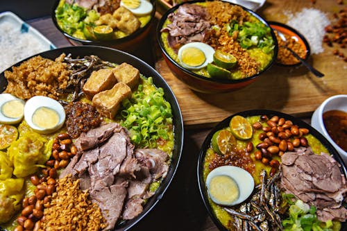 Close Up Photo of Cooked Dishes on Wooden Table