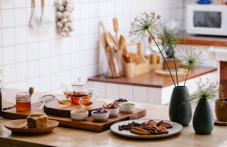 Teapot And Herbs On The Kitchen Counter 